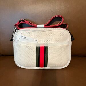 HAUTE SHORE White Crossbody Bag with Red and Black Stripes